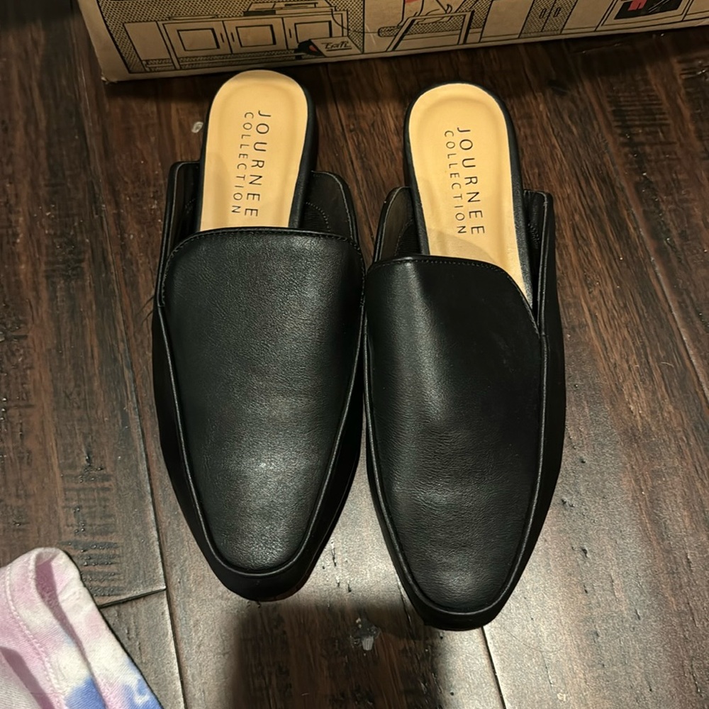Black leather slip ons